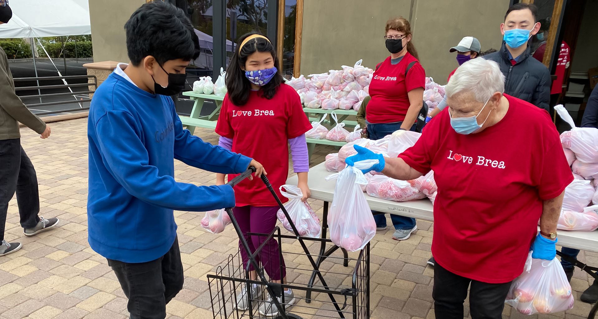 Volunteers at Love Brea distributing food